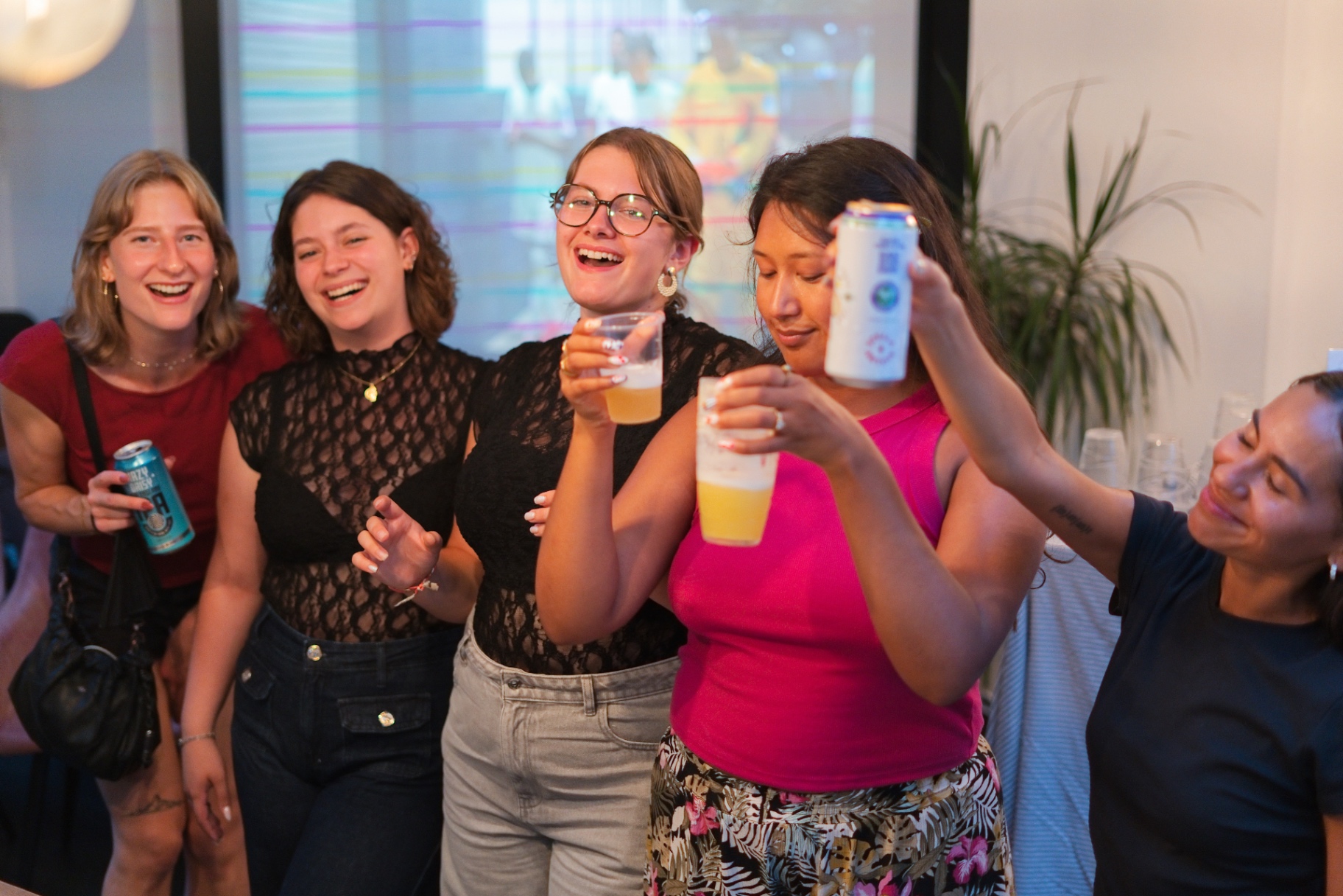 Guests cheers-ing at a social night